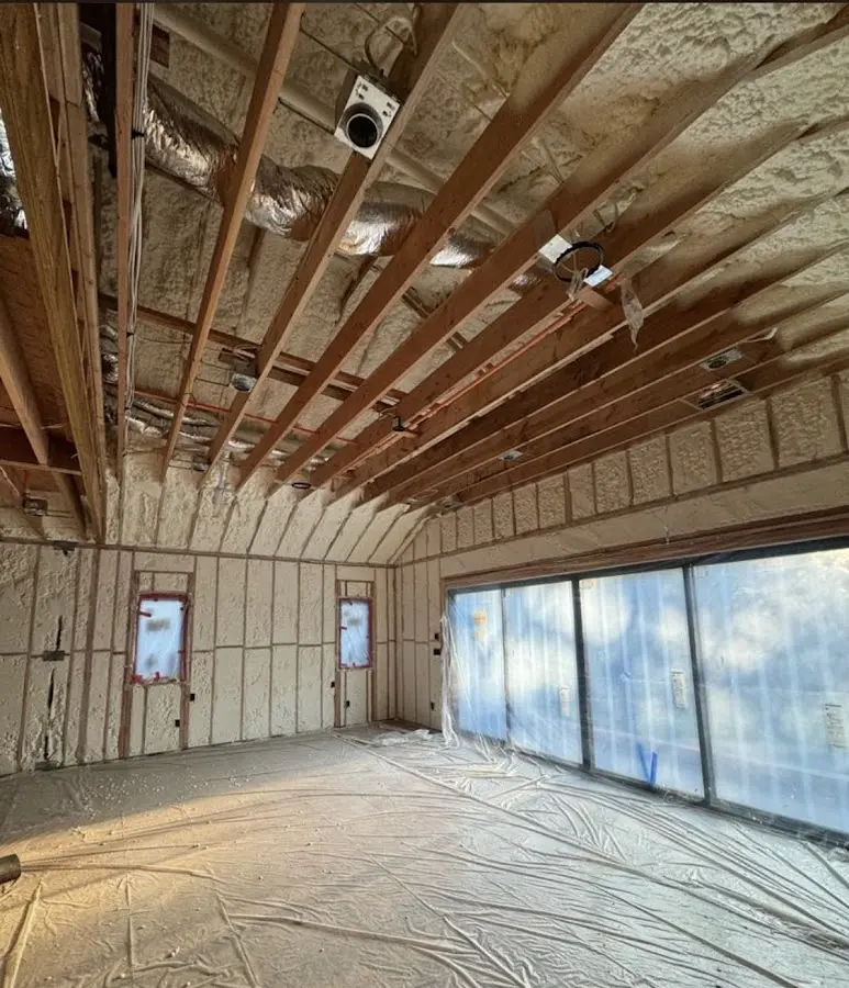 Interior walls and ceiling insulated with spray foam during new construction in Marilla